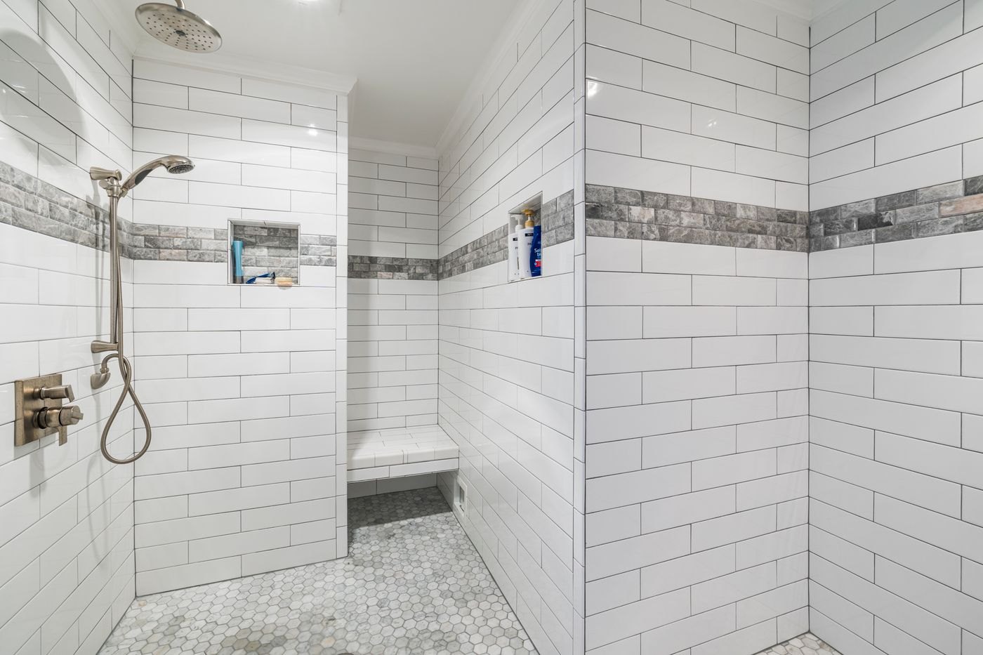 Handheld shower and tiled bench
